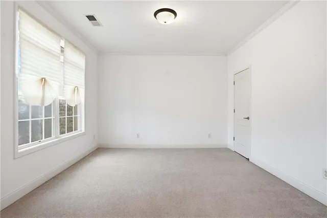 a living room with a couch and a window