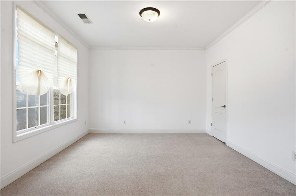 60 Heritage Keep Covington, GA 30016 - Photo 8 of 48 an empty room with a empty space and windows