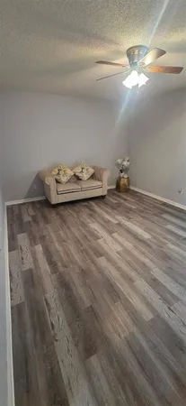 a view of a room with wooden floor