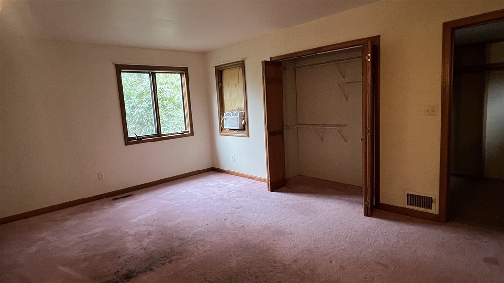 50 Head Of The Bay Road Bourne, MA 02532 - Photo 14 of 17 an empty room with windows and closet