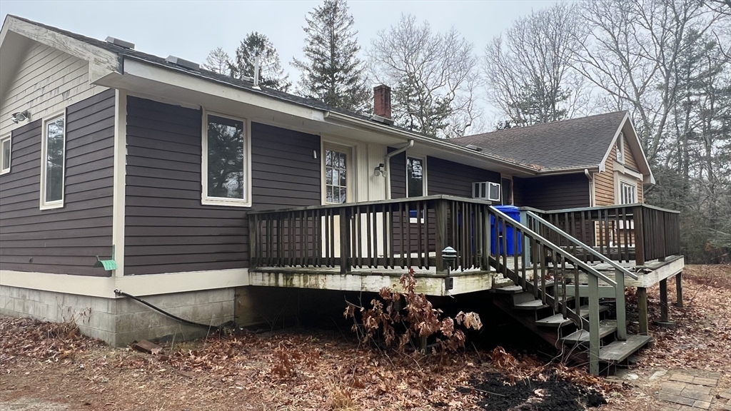 50 Head Of The Bay Road Bourne, MA 02532 - Photo 16 of 17 a balcony with table and chairs
