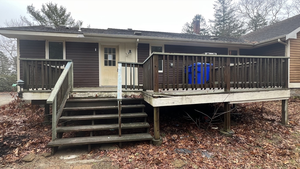50 Head Of The Bay Road Bourne, MA 02532 - Photo 17 of 17 a view of house with wooden deck and furniture