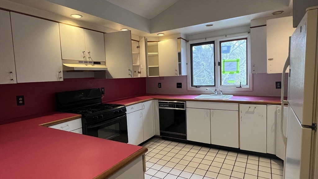 50 Head Of The Bay Road Bourne, MA 02532 - Photo 3 of 17 a kitchen with a sink cabinets and window
