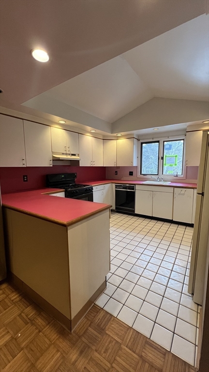 50 Head Of The Bay Road Bourne, MA 02532 - Photo 4 of 17 a kitchen with stainless steel appliances granite countertop a stove a sink and a microwave
