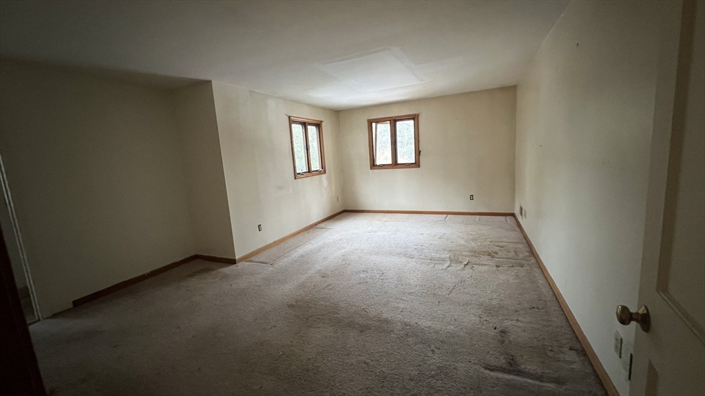 50 Head Of The Bay Road Bourne, MA 02532 - Photo 7 of 17 an empty room with windows
