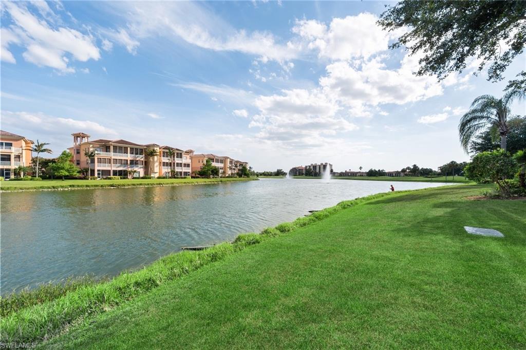 722 Regency Reserve Circle, Unit 3001 Naples, FL 34119 - Photo 1 of 22 a view of a lake with houses in the back