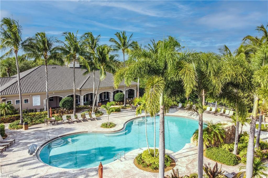 722 Regency Reserve Circle, Unit 3001 Naples, FL 34119 - Photo 17 of 22 a view of a swimming pool with a patio