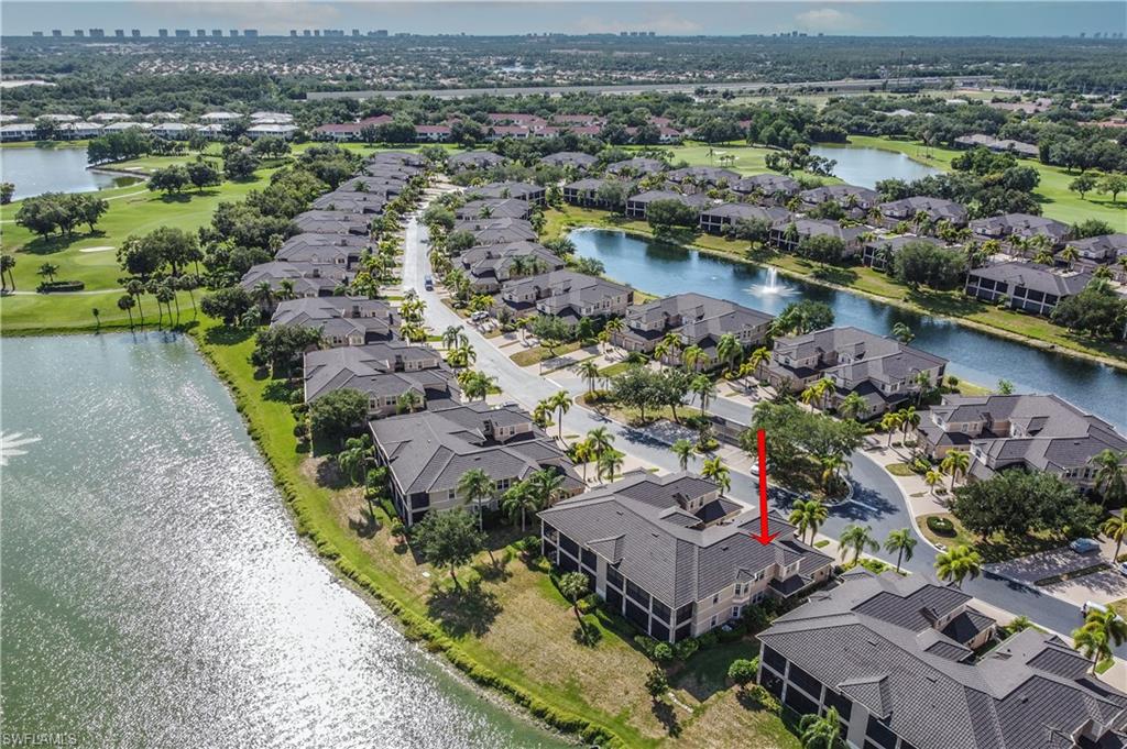 722 Regency Reserve Circle, Unit 3001 Naples, FL 34119 - Photo 19 of 22 an aerial view of lake and residential houses with outdoor space