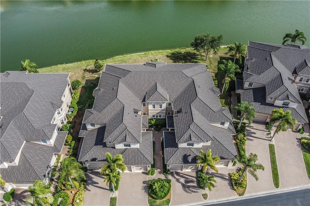 722 Regency Reserve Circle, Unit 3001 Naples, FL 34119 - Photo 20 of 22 an aerial view of a house with a yard
