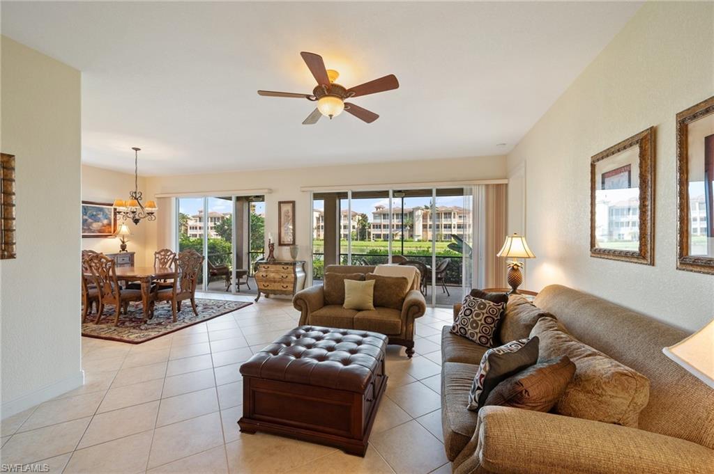 722 Regency Reserve Circle, Unit 3001 Naples, FL 34119 - Photo 4 of 22 a living room with furniture and a large window