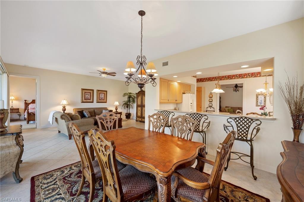 722 Regency Reserve Circle, Unit 3001 Naples, FL 34119 - Photo 7 of 22 a view of a dining room with furniture