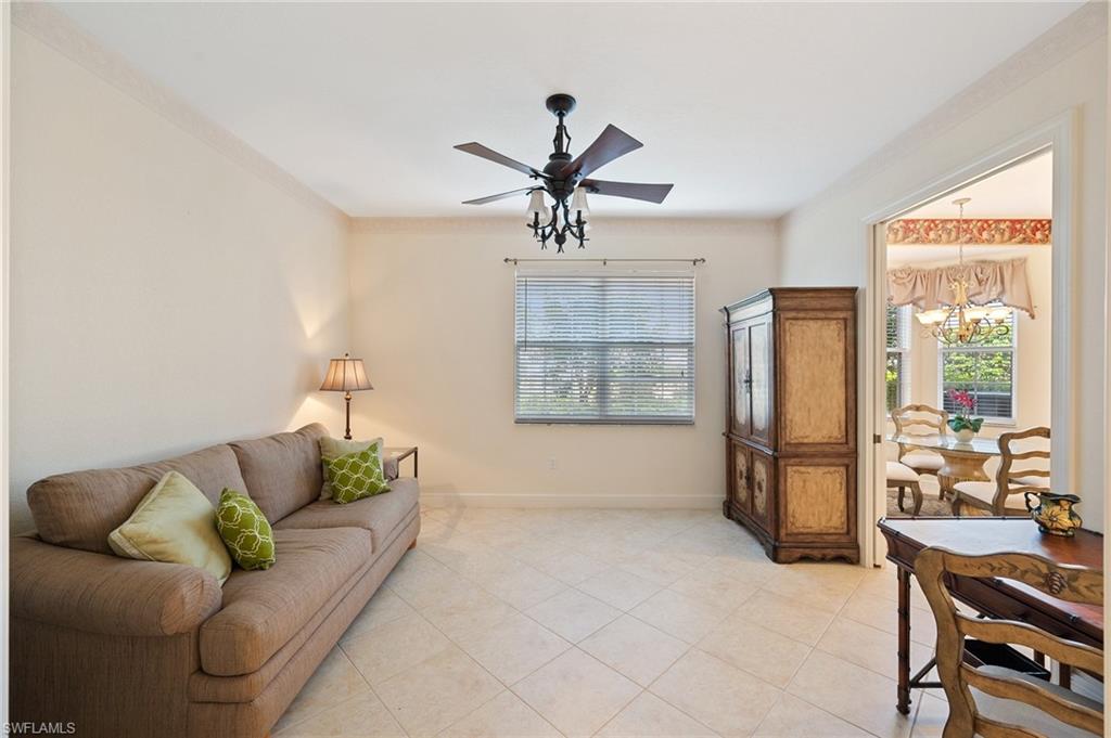 722 Regency Reserve Circle, Unit 3001 Naples, FL 34119 - Photo 9 of 22 a living room with furniture and a window