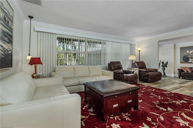 8522 Lagoon Road Fort Myers Beach, FL 33931 - Photo 12 of 32 Nice size living room overlooking the meticulously tropical landscape.