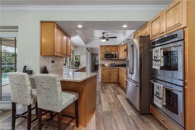 8522 Lagoon Road Fort Myers Beach, FL 33931 - Photo 3 of 32 Double oven, plenty of counter space and breakfast bar