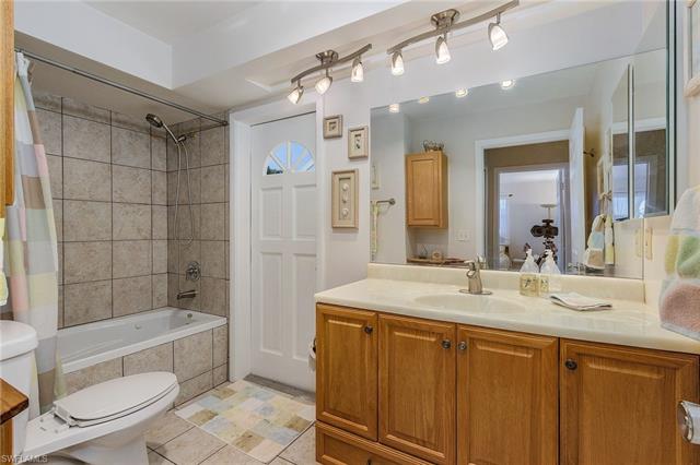 8522 Lagoon Road Fort Myers Beach, FL 33931 - Photo 32 of 32 Bathroom conveniently located with entrance from bedrooms and pool area.