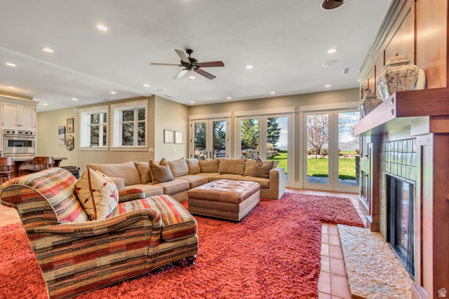 2579 Splendor Valley Road Kamas, UT 84036 - Photo 60 of 87 Living area with recessed lighting, light tile patterned flooring, ceiling fan, and a fireplace