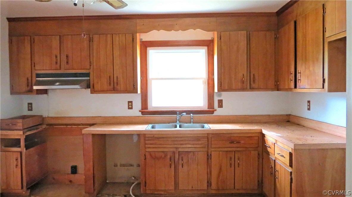 11500 Beach Road Chesterfield, VA 23832 - Photo 3 of 29 a kitchen with stainless steel appliances granite countertop a sink window and cabinets