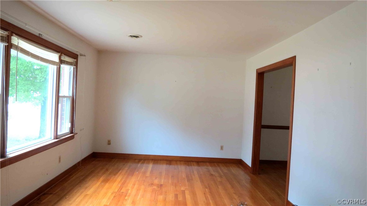 11500 Beach Road Chesterfield, VA 23832 - Photo 5 of 29 an empty room with wooden floor and windows