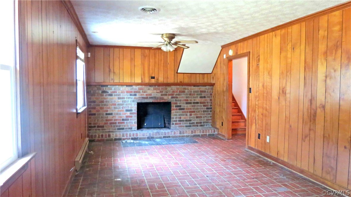 11500 Beach Road Chesterfield, VA 23832 - Photo 8 of 29 a view of empty room with fireplace and wooden floor