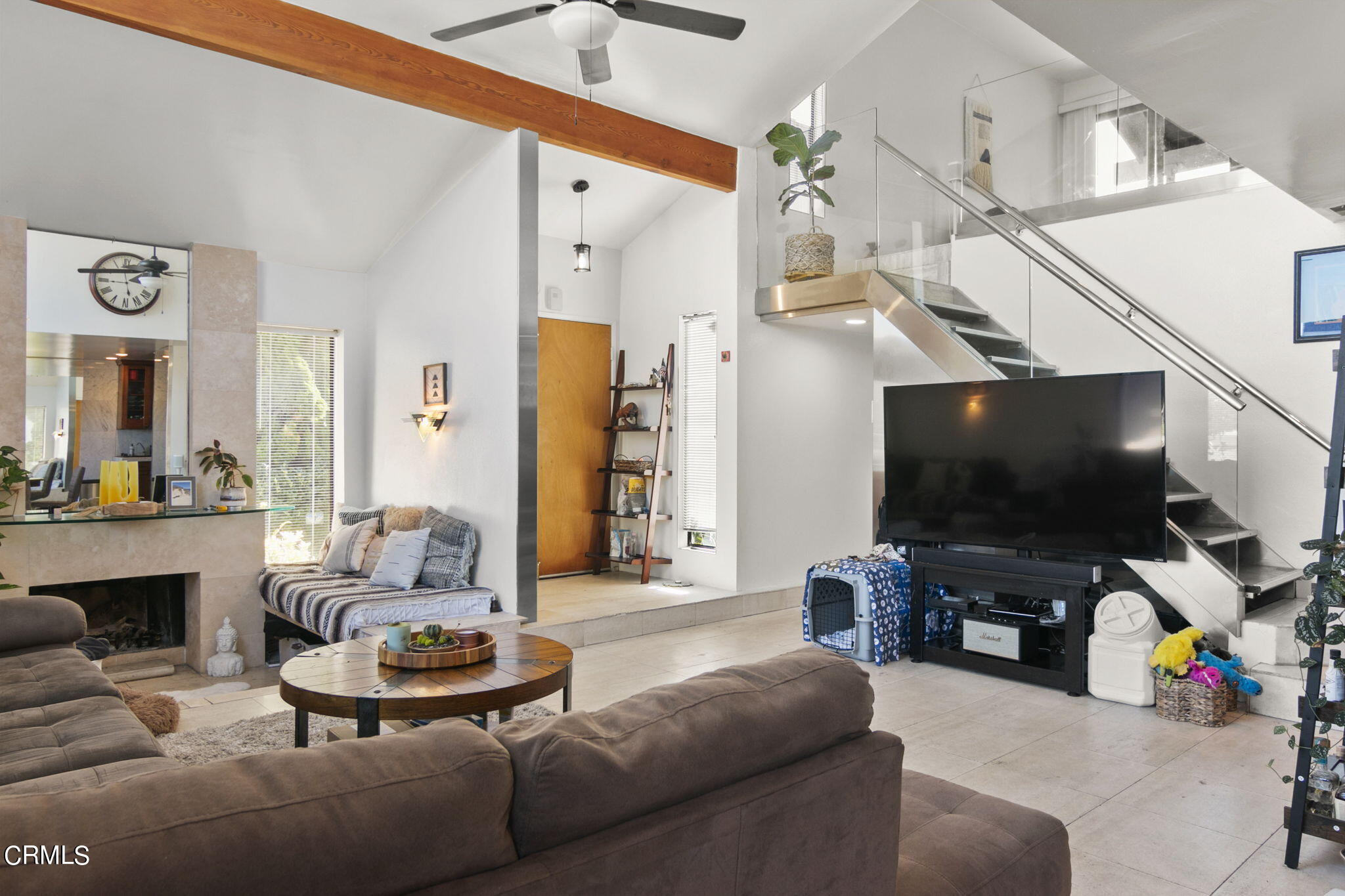a living room with furniture and a flat screen tv