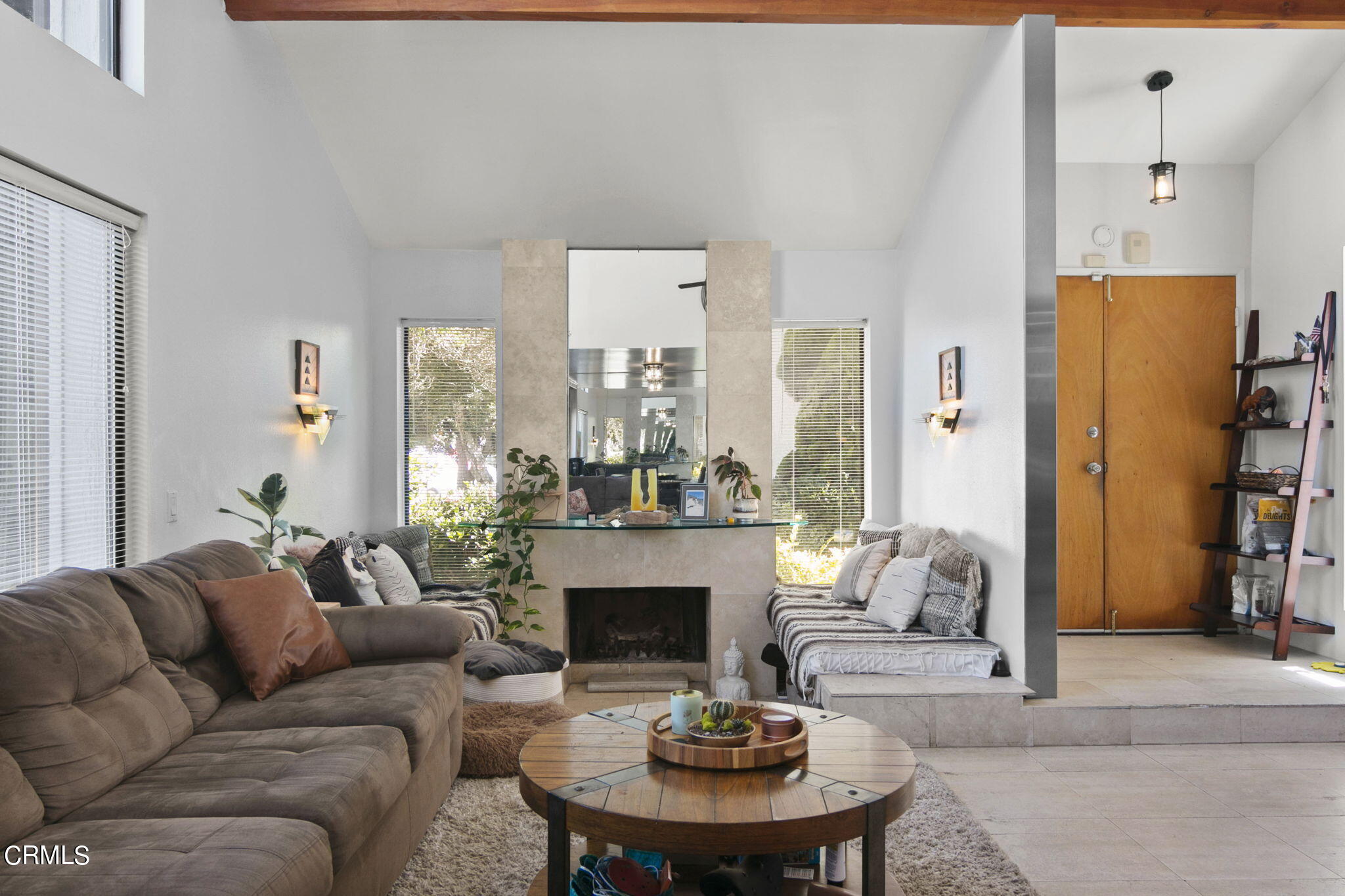 3334 Sunset Lane Oxnard, CA 93035 - Photo 11 of 37 a living room with furniture a fireplace and a large window