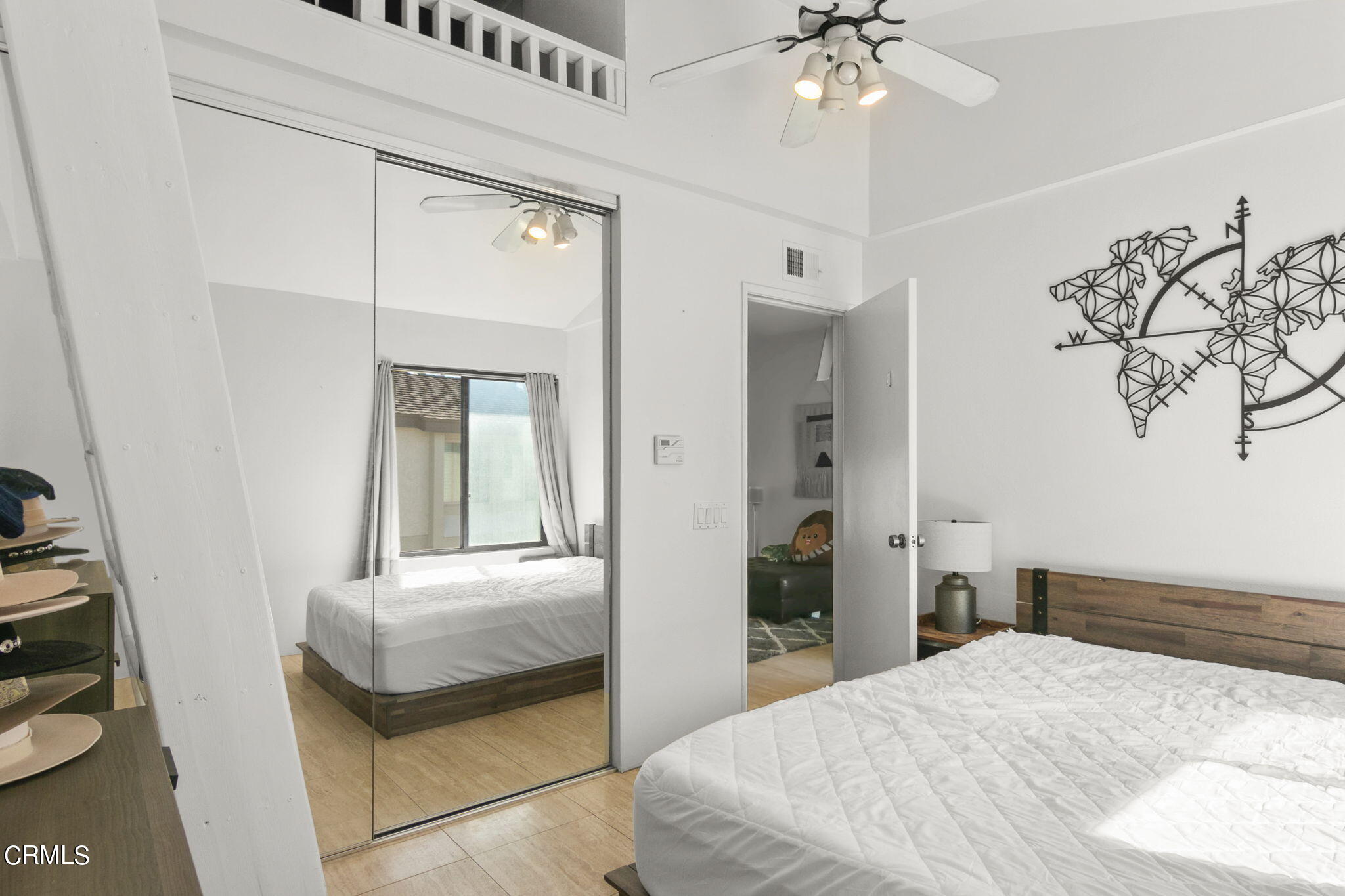 3334 Sunset Lane Oxnard, CA 93035 - Photo 26 of 37 a bedroom with a bed and a chandelier