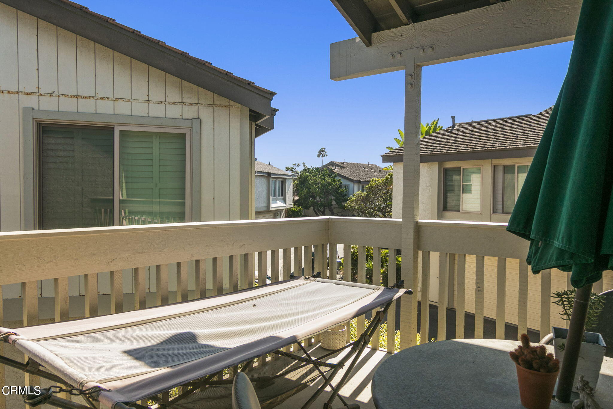 3334 Sunset Lane Oxnard, CA 93035 - Photo 28 of 37 a view of a balcony with a table and chairs