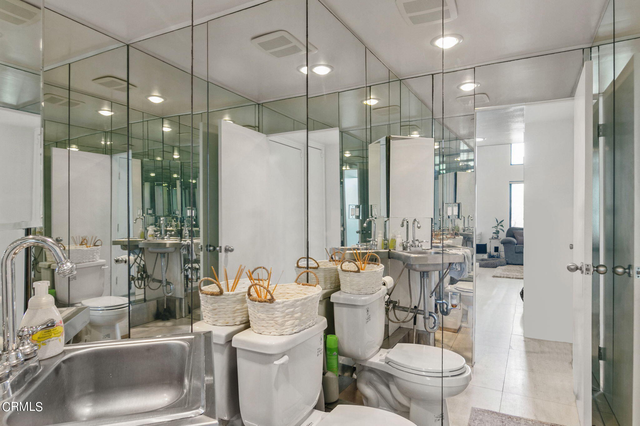 3334 Sunset Lane Oxnard, CA 93035 - Photo 29 of 37 a bathroom with a toilet sink and mirror
