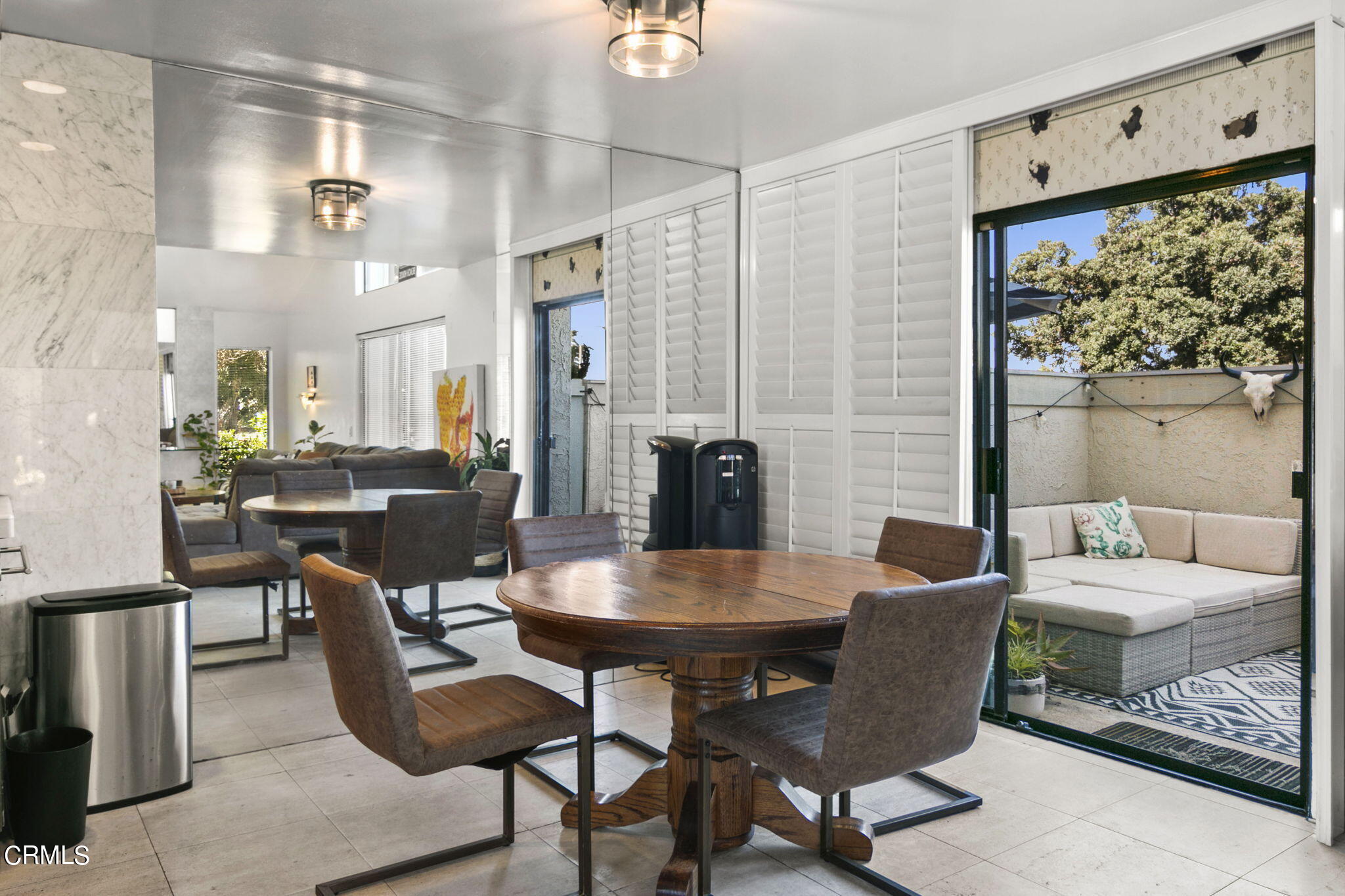 3334 Sunset Lane Oxnard, CA 93035 - Photo 9 of 37 a view of a dining room with furniture and a large window