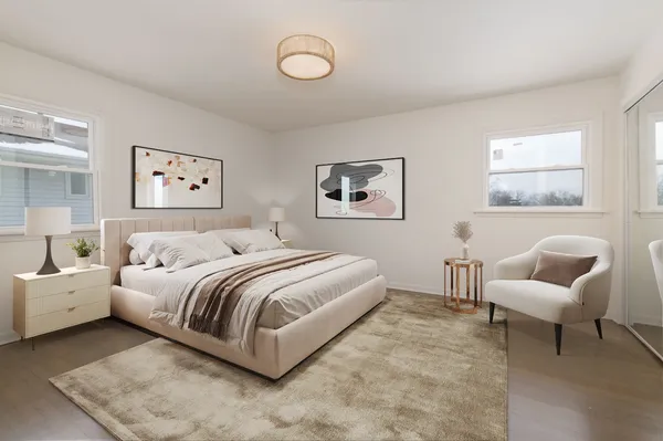 a bedroom with a bed and a couch