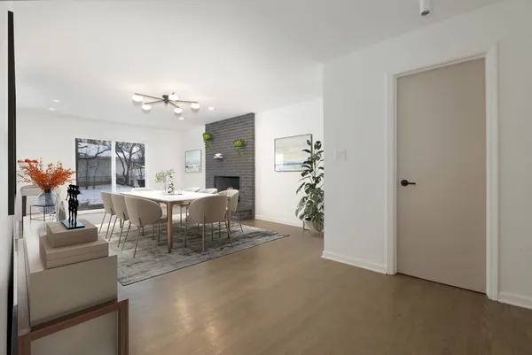 a view of a dining room with furniture and chandelier