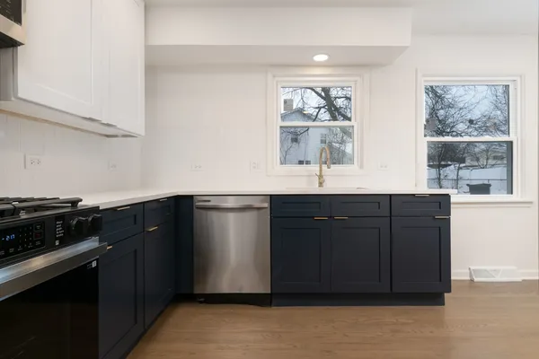 a kitchen with granite countertop a cabinets and a stove