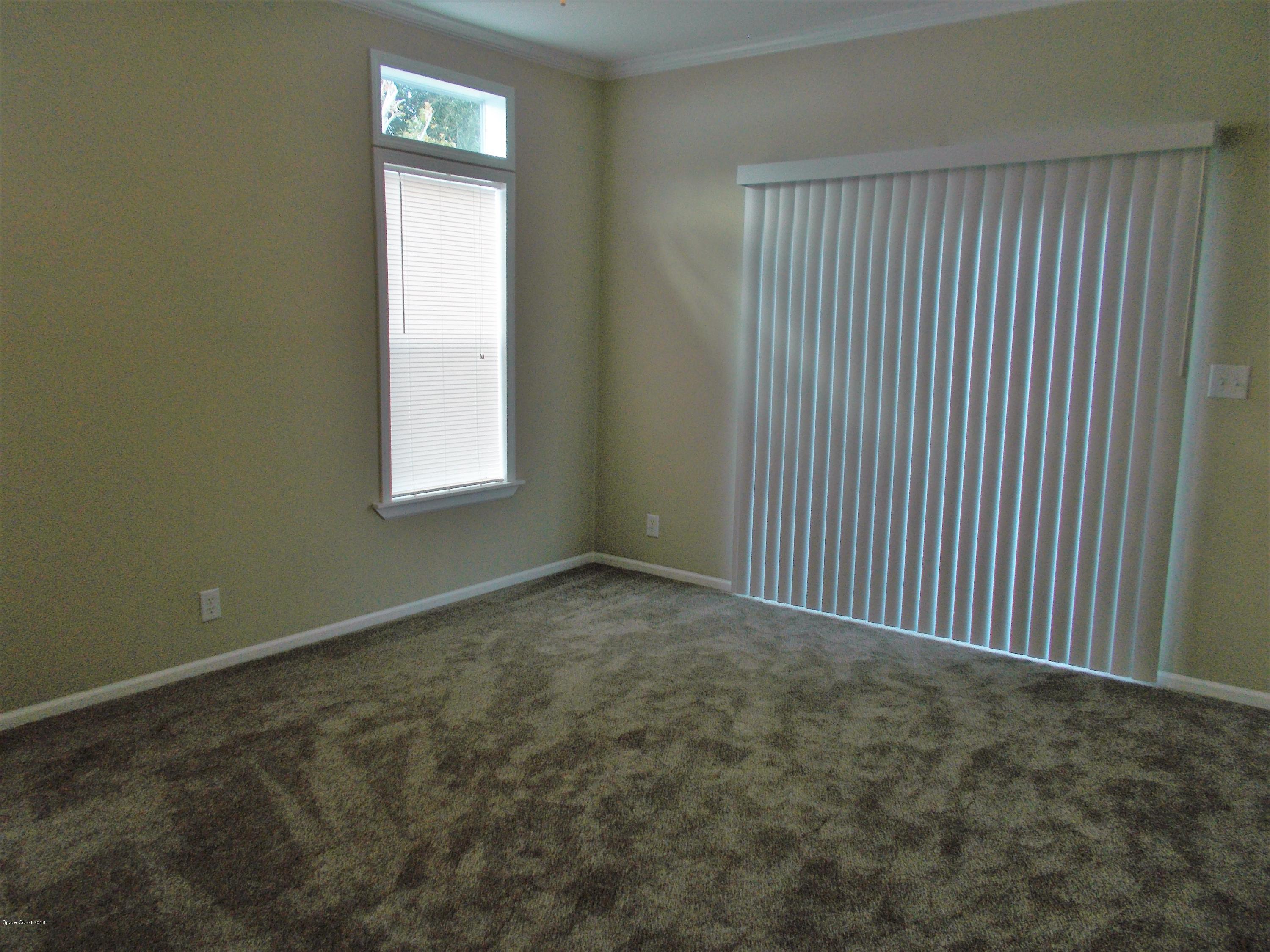 1054 Sebastian Road Barefoot Bay, FL 32976 - Photo 11 of 24 MASTER BEDROOM
