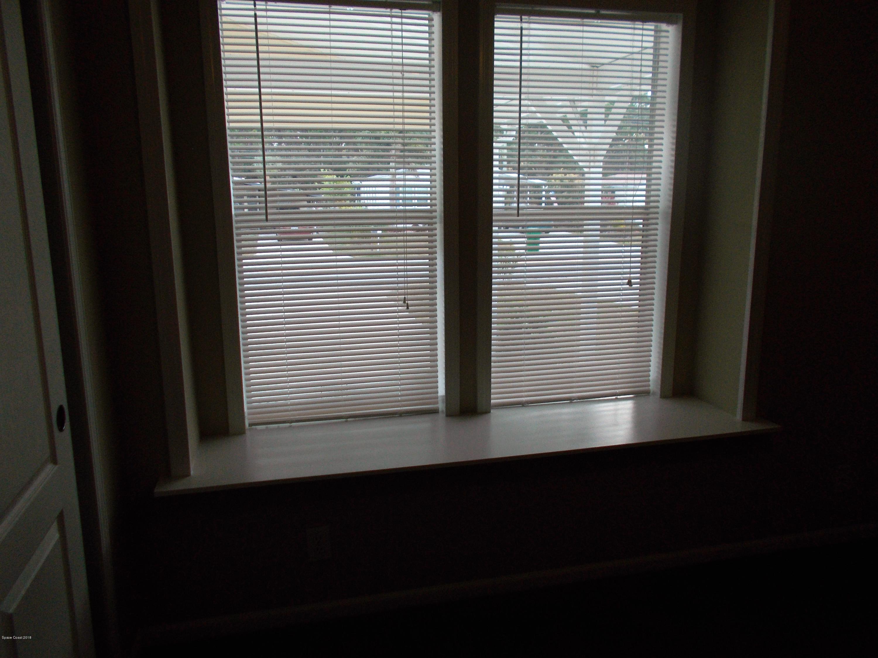 1054 Sebastian Road Barefoot Bay, FL 32976 - Photo 20 of 24 FRONT WINDOW GUEST ROOM