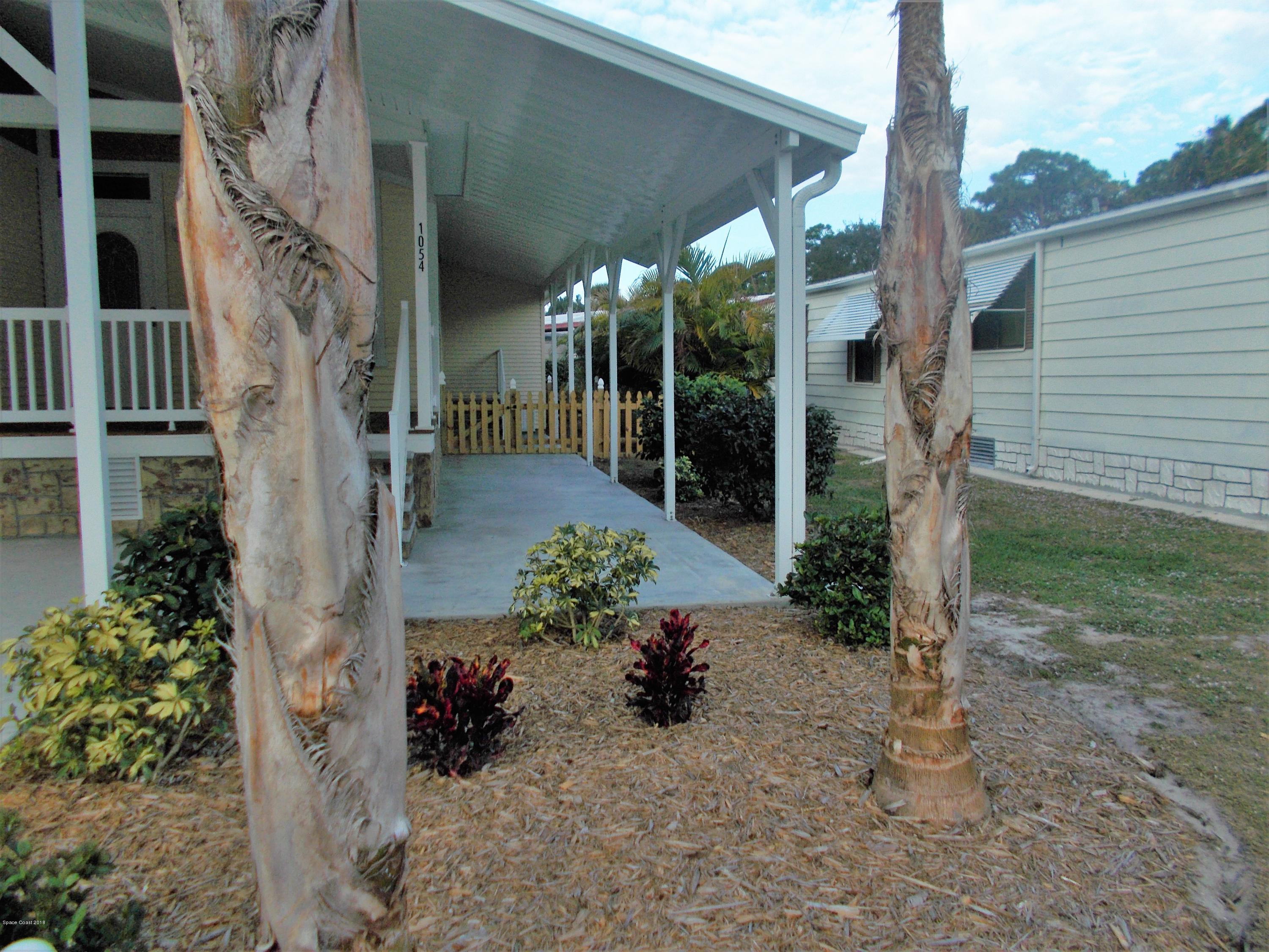 1054 Sebastian Road Barefoot Bay, FL 32976 - Photo 24 of 24 FRONT GARDENS