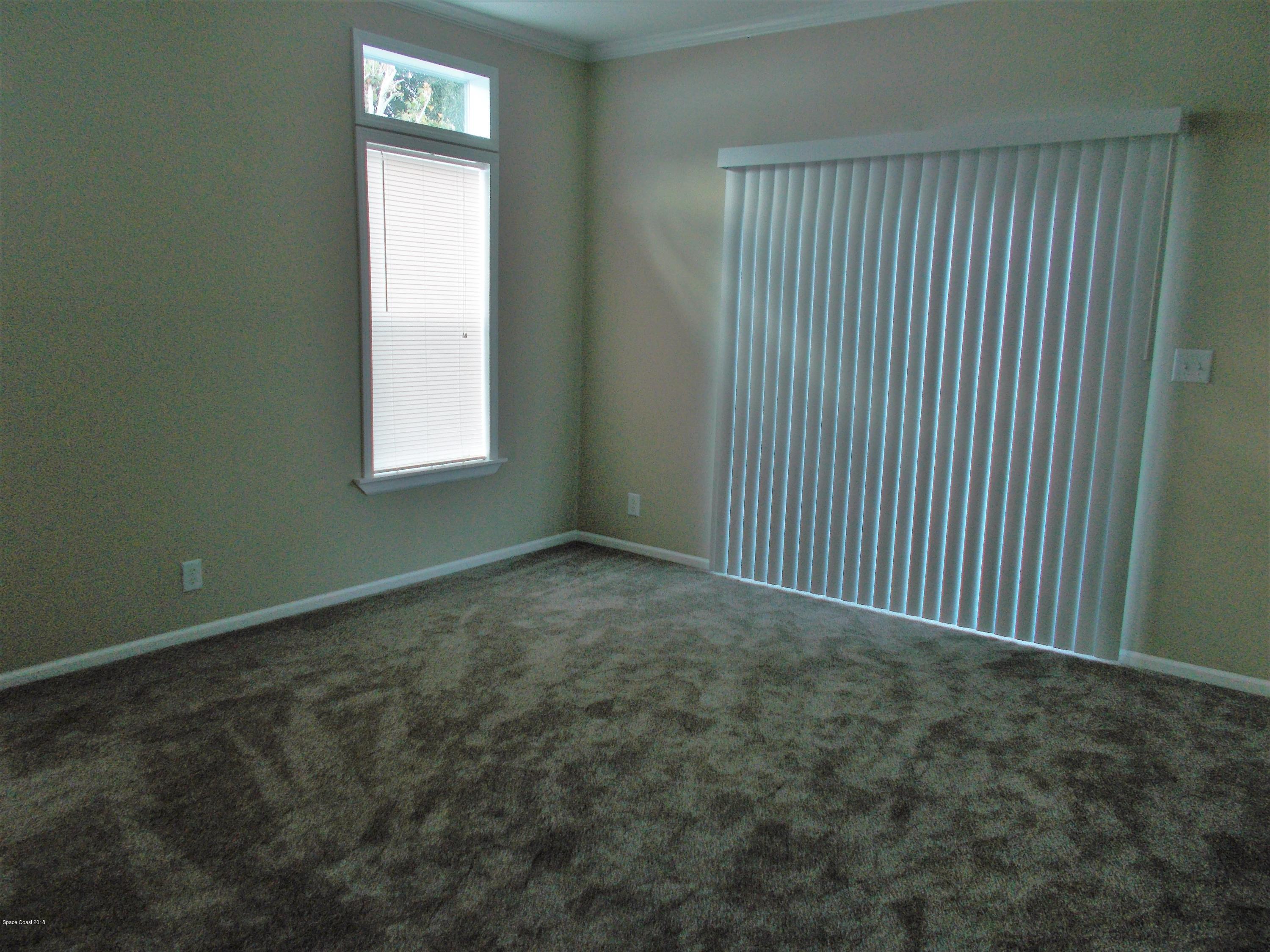 1054 Sebastian Road Barefoot Bay, FL 32976 - Photo 10 of 24 MASTER BEDROOM