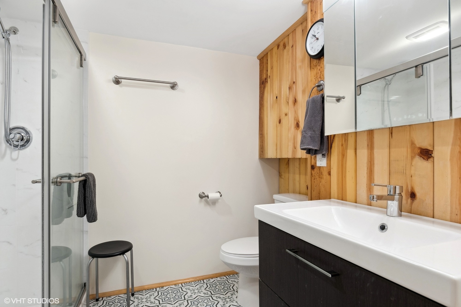 659 Deerpath Drive Deerfield, IL 60015 - Photo 17 of 22 a bathroom with a sink a toilet and shower