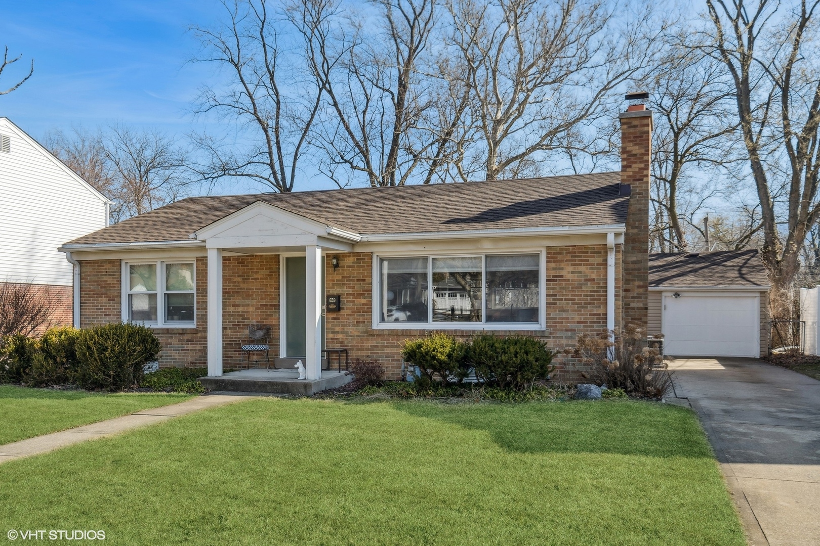 659 Deerpath Drive Deerfield, IL 60015 - Photo 2 of 22 front view of a house with a garden