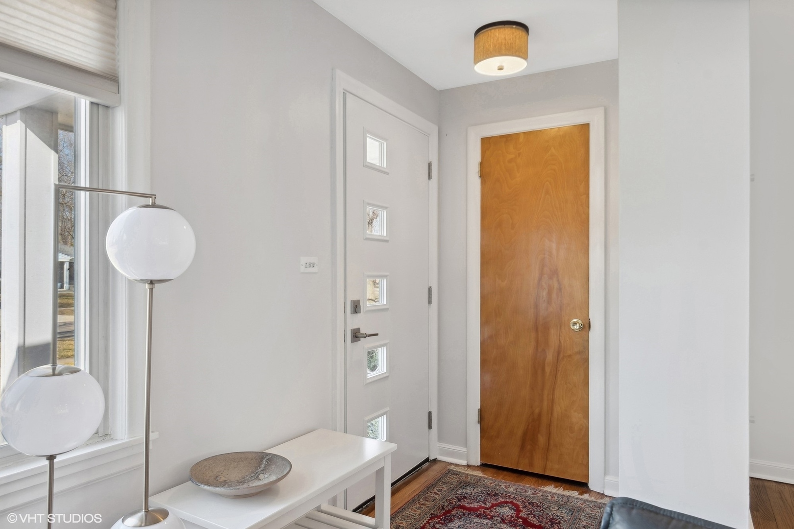 659 Deerpath Drive Deerfield, IL 60015 - Photo 3 of 22 a bedroom with a bed and a chandelier