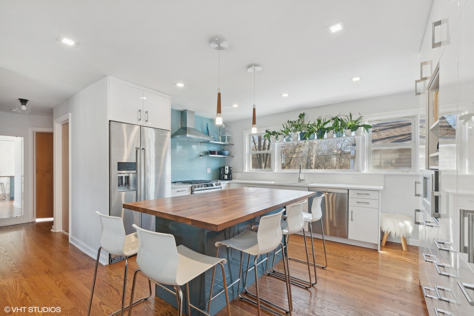 659 Deerpath Drive Deerfield, IL 60015 - Photo 5 of 22 a kitchen with stainless steel appliances granite countertop a kitchen island a stove a table and a refrigerator