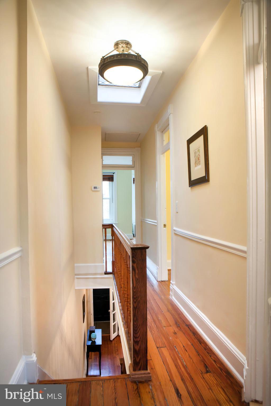 917 E Street Southeast Washington, DC 20003 - Photo 19 of 30 a view of a livingroom with wooden floor and a ceiling fan