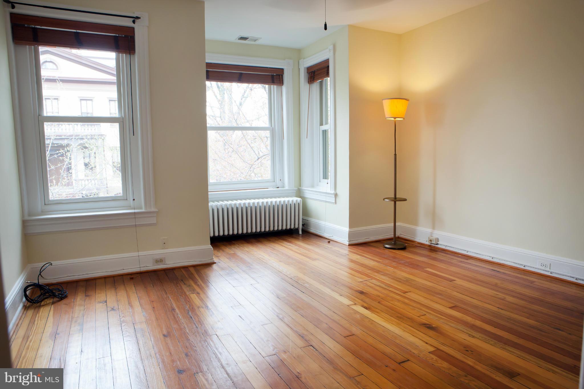 917 E Street Southeast Washington, DC 20003 - Photo 20 of 30 an empty room with wooden floor and windows