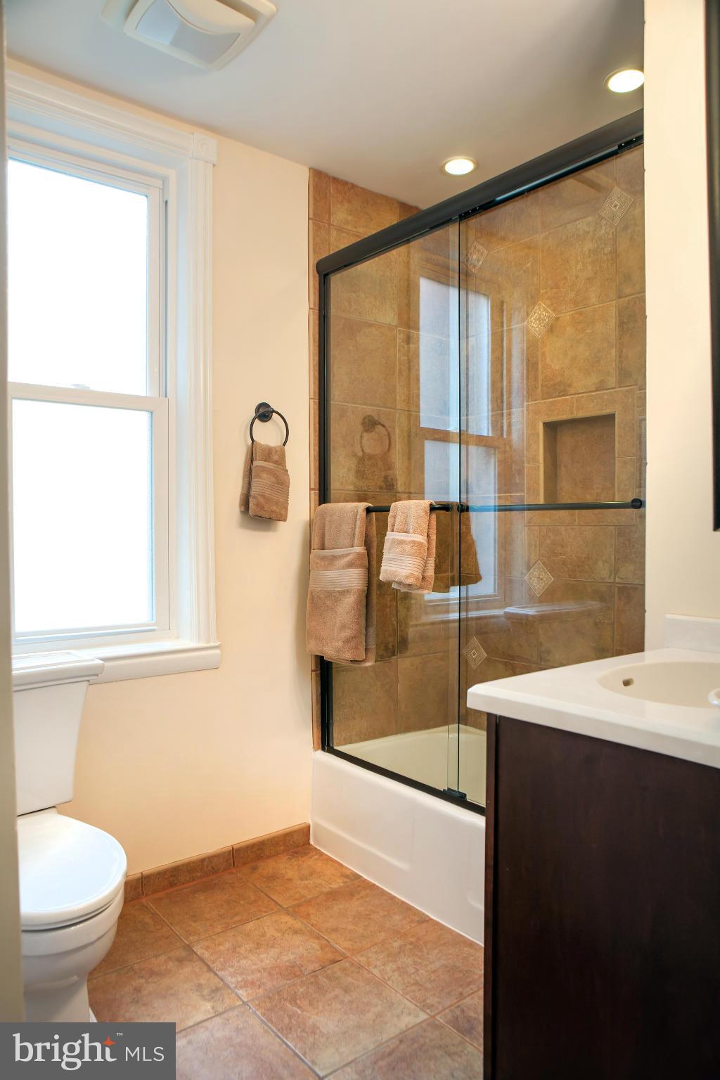 917 E Street Southeast Washington, DC 20003 - Photo 24 of 30 a bathroom with a sink toilet and mirror