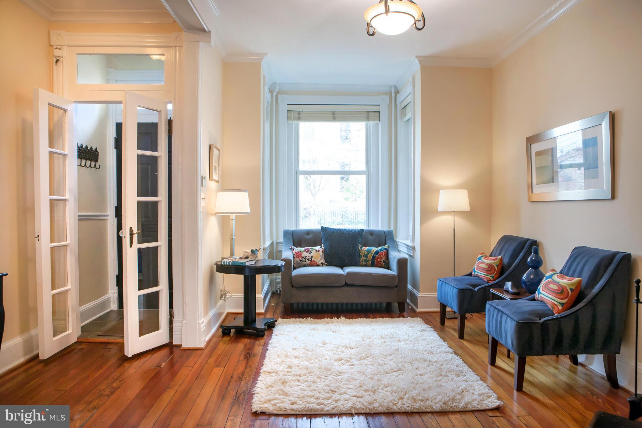 917 E Street Southeast Washington, DC 20003 - Photo 4 of 30 a living room with furniture rug and wooden floor
