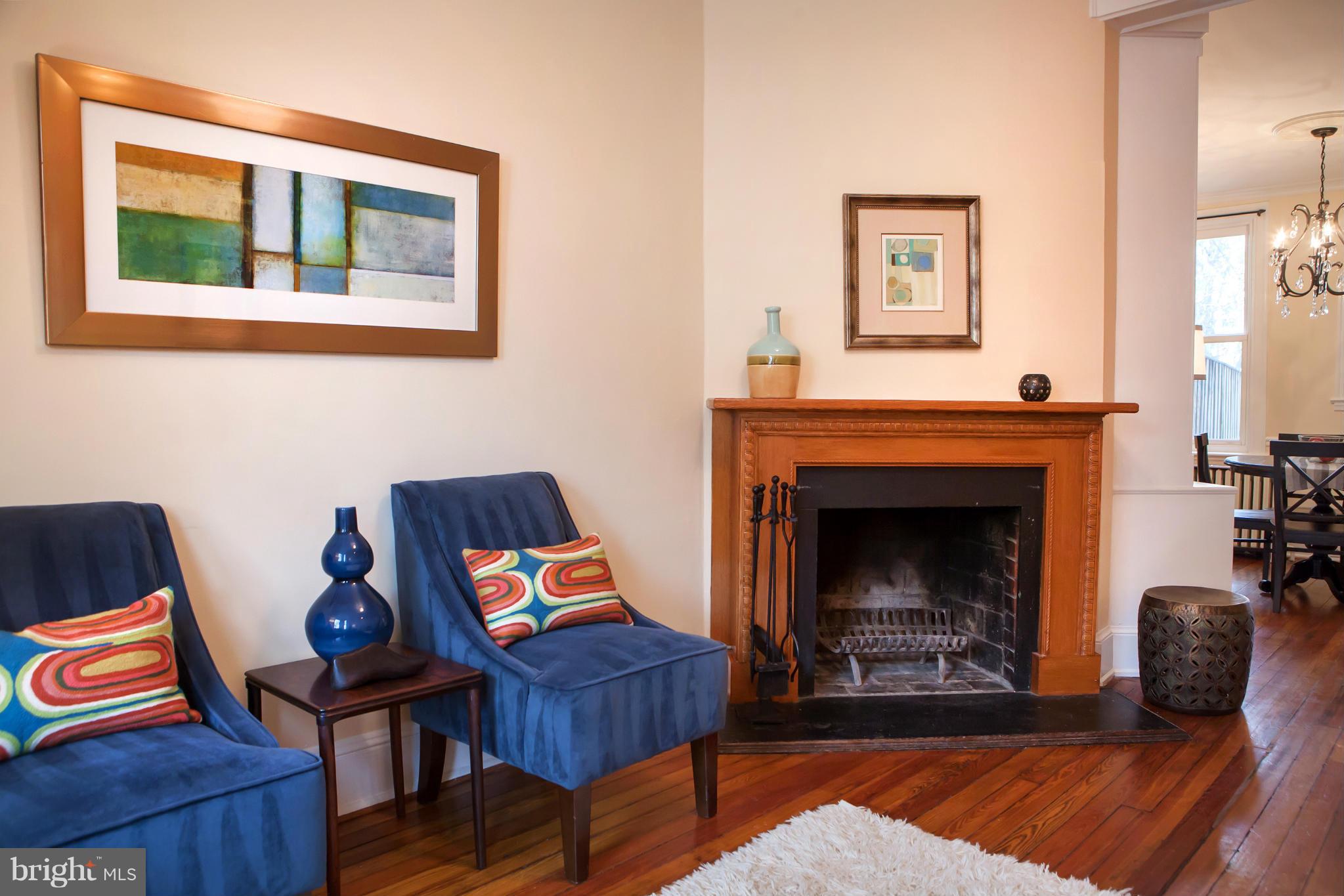 917 E Street Southeast Washington, DC 20003 - Photo 7 of 30 a living room with furniture and a fireplace