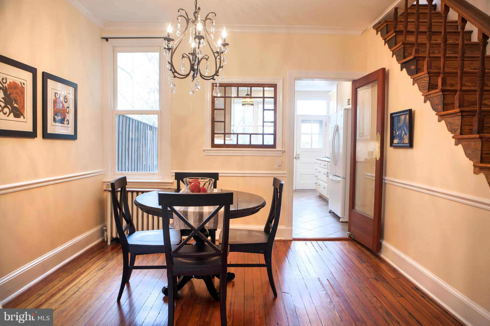 917 E Street Southeast Washington, DC 20003 - Photo 10 of 30 a view of a dining room with furniture wooden floor and chandelier