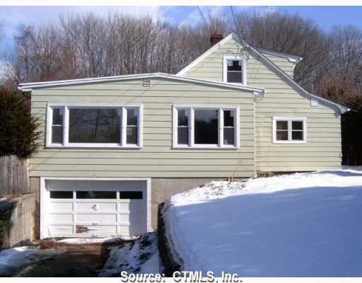 118 Waterbury Road Prospect, CT 06712 - Photo 1 of 1 a front view of a house with a yard