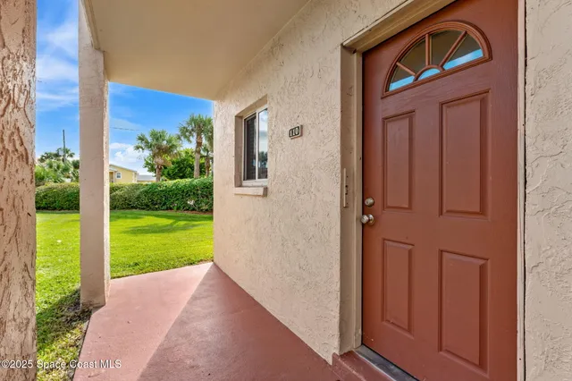 a view of house with backyard space and garden