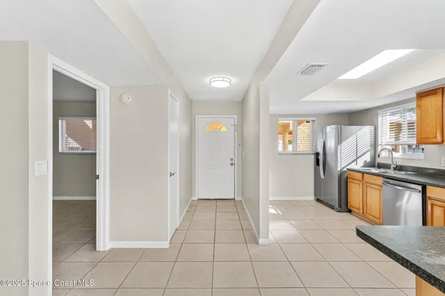 a view of a kitchen from the hallway
