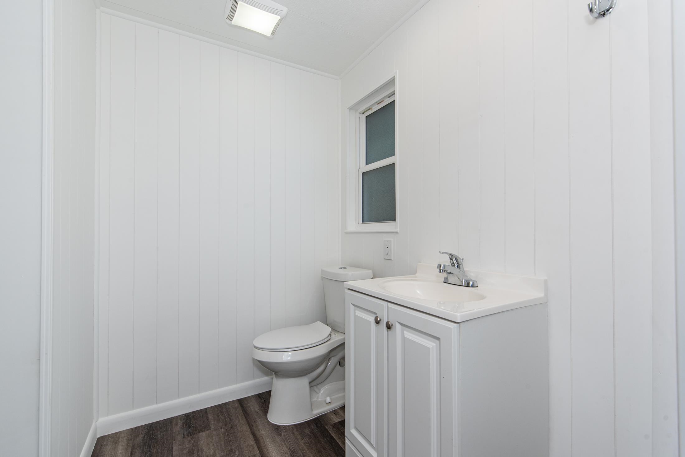 905 Palermo Road St. Augustine, FL 32086 - Photo 14 of 30 a bathroom with sink toilet and mirror